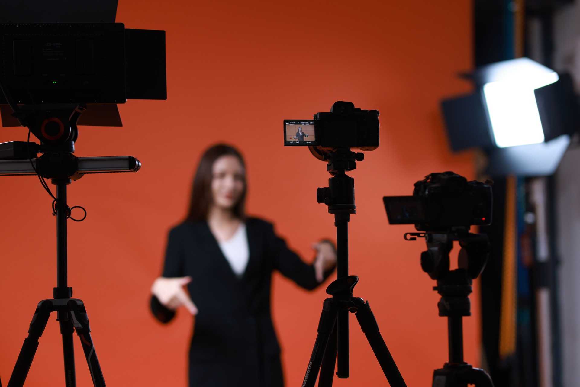 Back state of a young  female model in studio  steadicam during the shooting of a commercial  advertisement